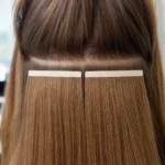 Two 3-inch Truly Seamless tape wefts placed side by side across the back of the head at the attachment point.